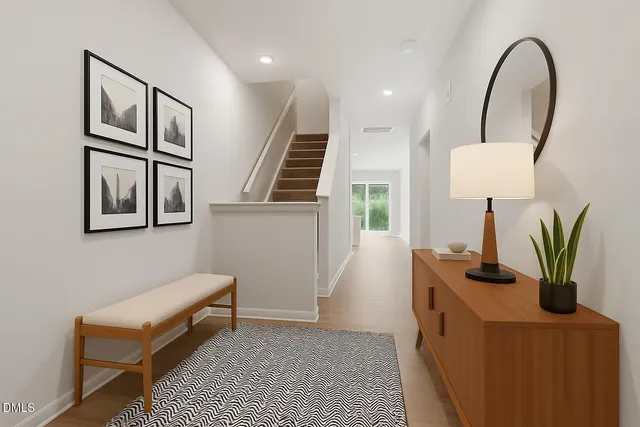 a view of living room with furniture and wooden floor