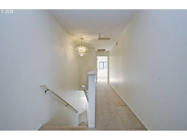 a view of a hallway with entryway