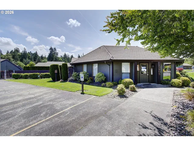 a view of a house with basketball court