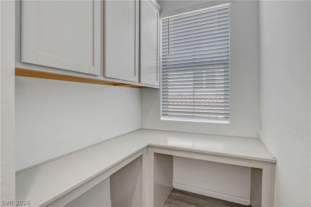 2555 Hampton Road, Unit 2207 Henderson, NV 89052 - Photo 34 of 74 Functional workspace with built-in cabinetry and a sun-filtering window.