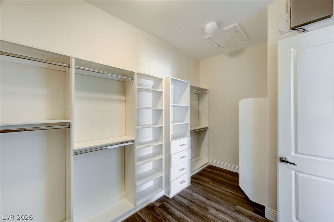 8197 Riley Love Street Las Vegas, NV 89139 - Photo 33 of 48 Organized closet space with built-in shelves and rods offers abundant storage solutions.