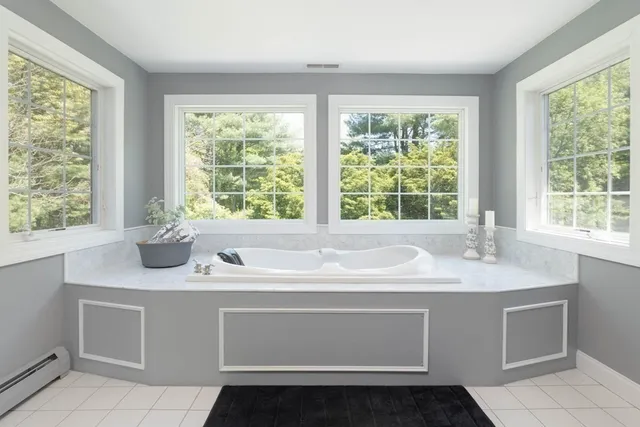 a bathroom with a sink and a window