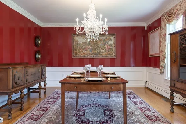 a dining room with furniture and a chandelier
