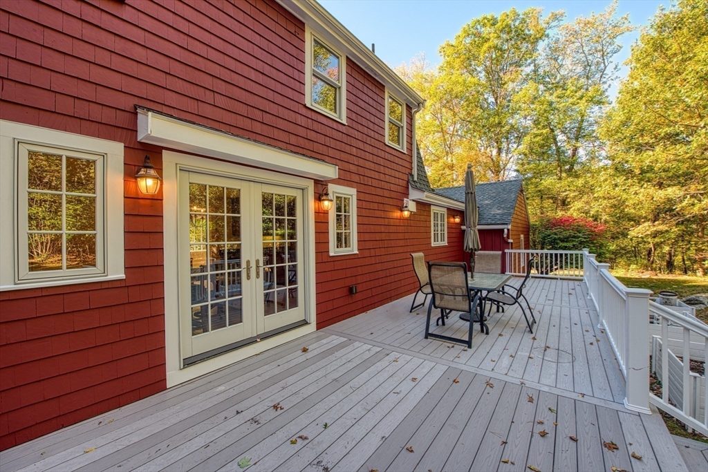 2 Beaver Brook Road Sharon, MA 02067 - Photo 6 of 9 a view of deck with table and chairs wooden floor and fence
