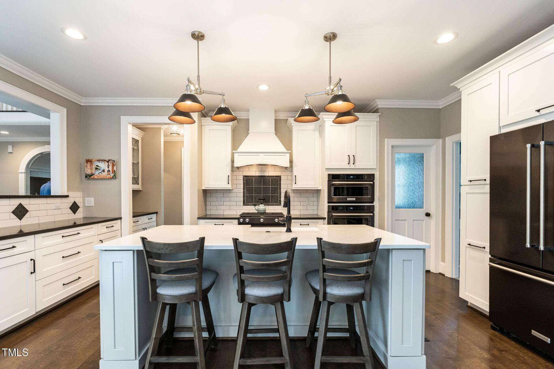 1228 Dorleath Court Raleigh, NC 27614 - Photo 11 of 47 a dining room with furniture a chandelier a wooden floor and a chandelier
