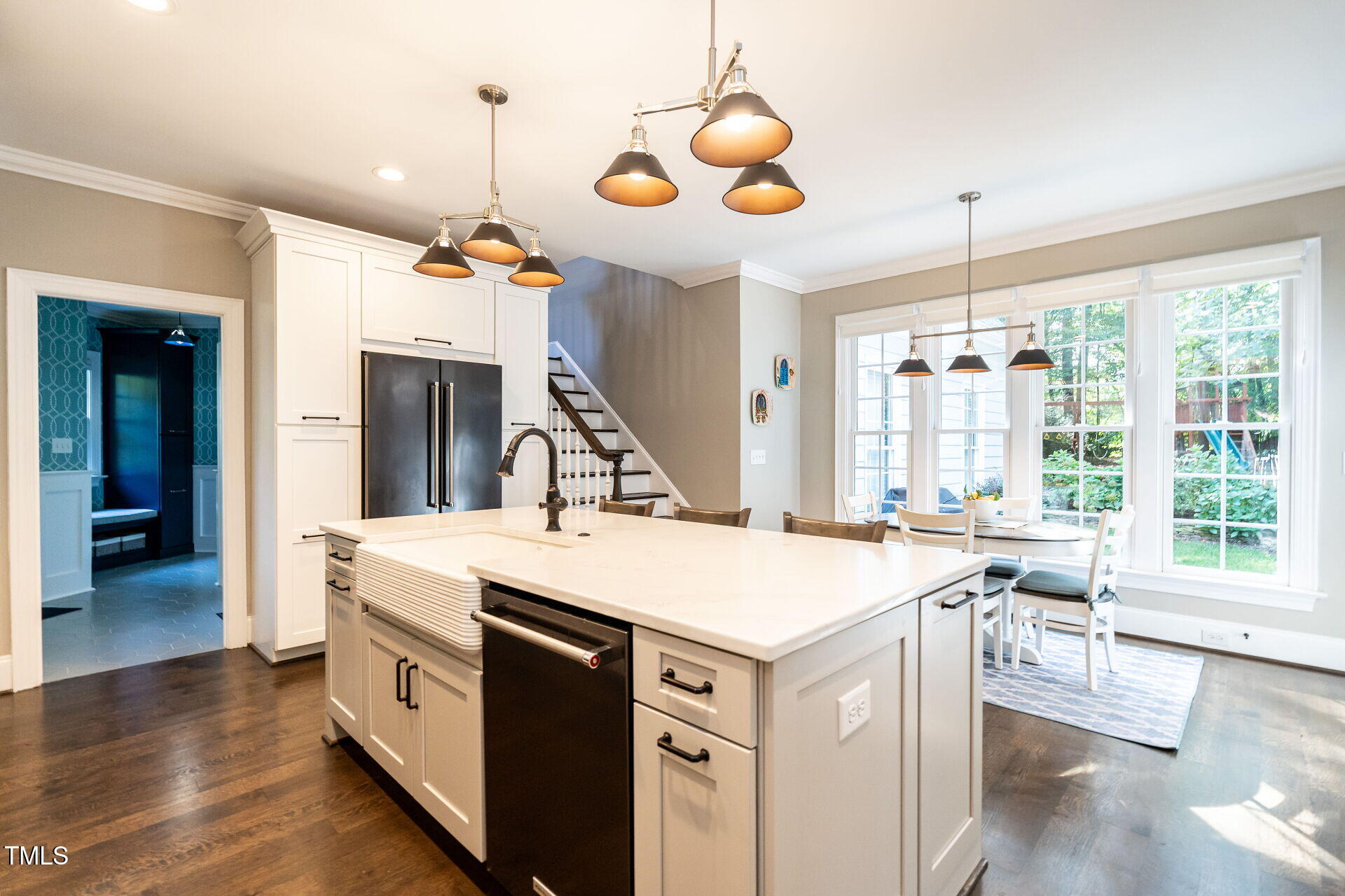 1228 Dorleath Court Raleigh, NC 27614 - Photo 12 of 47 a very nice looking dining room with a large center dining table chairs and couches
