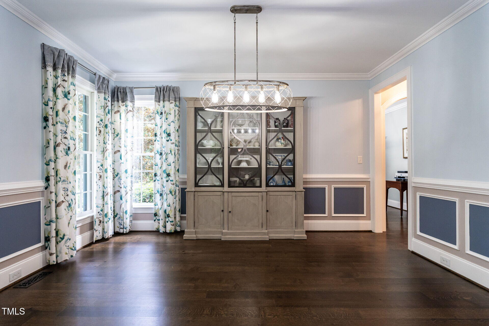 1228 Dorleath Court Raleigh, NC 27614 - Photo 16 of 47 a view of an empty room with wooden floor and a window