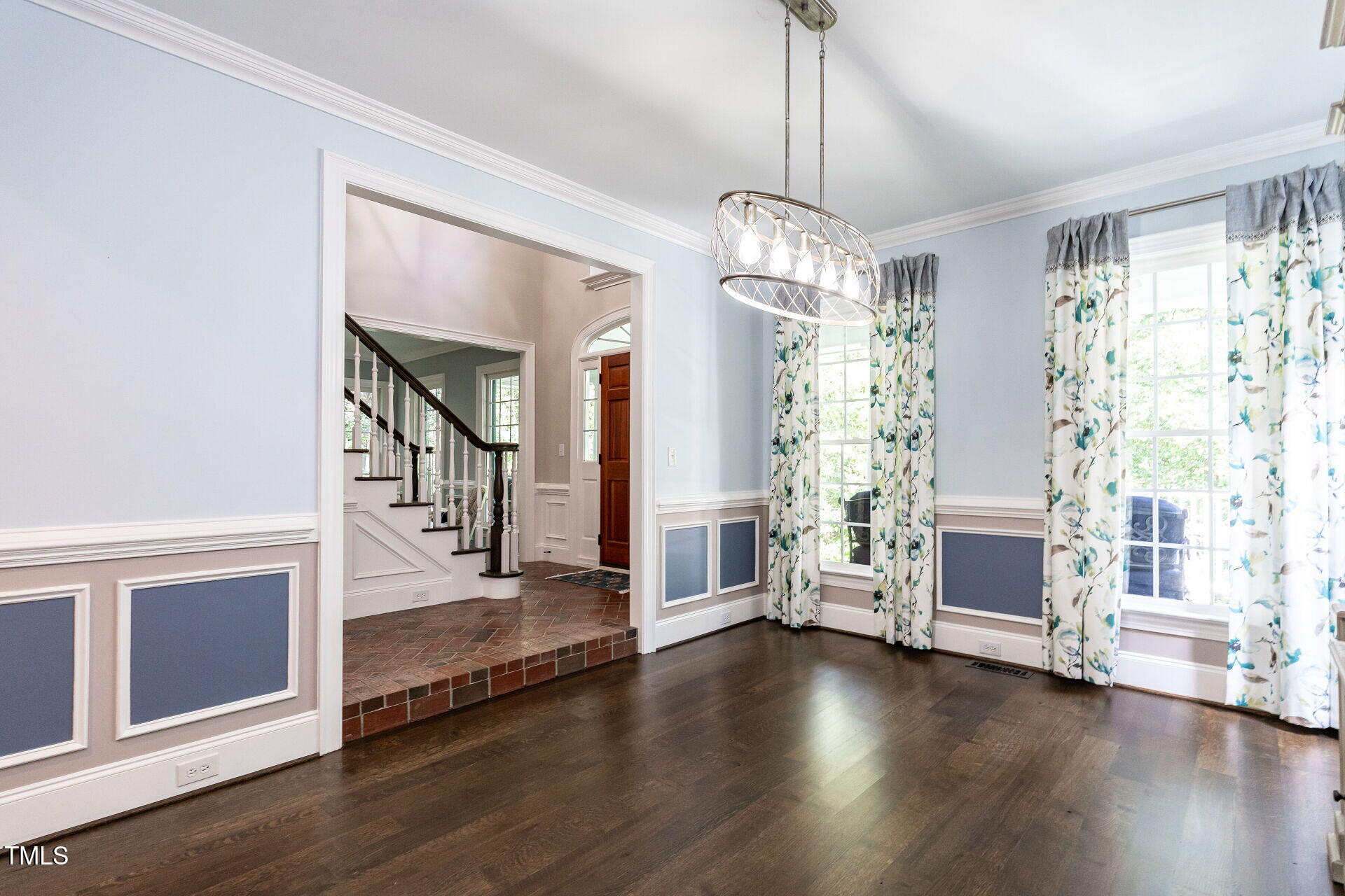 1228 Dorleath Court Raleigh, NC 27614 - Photo 17 of 47 a view of a livingroom with wooden floor and windows