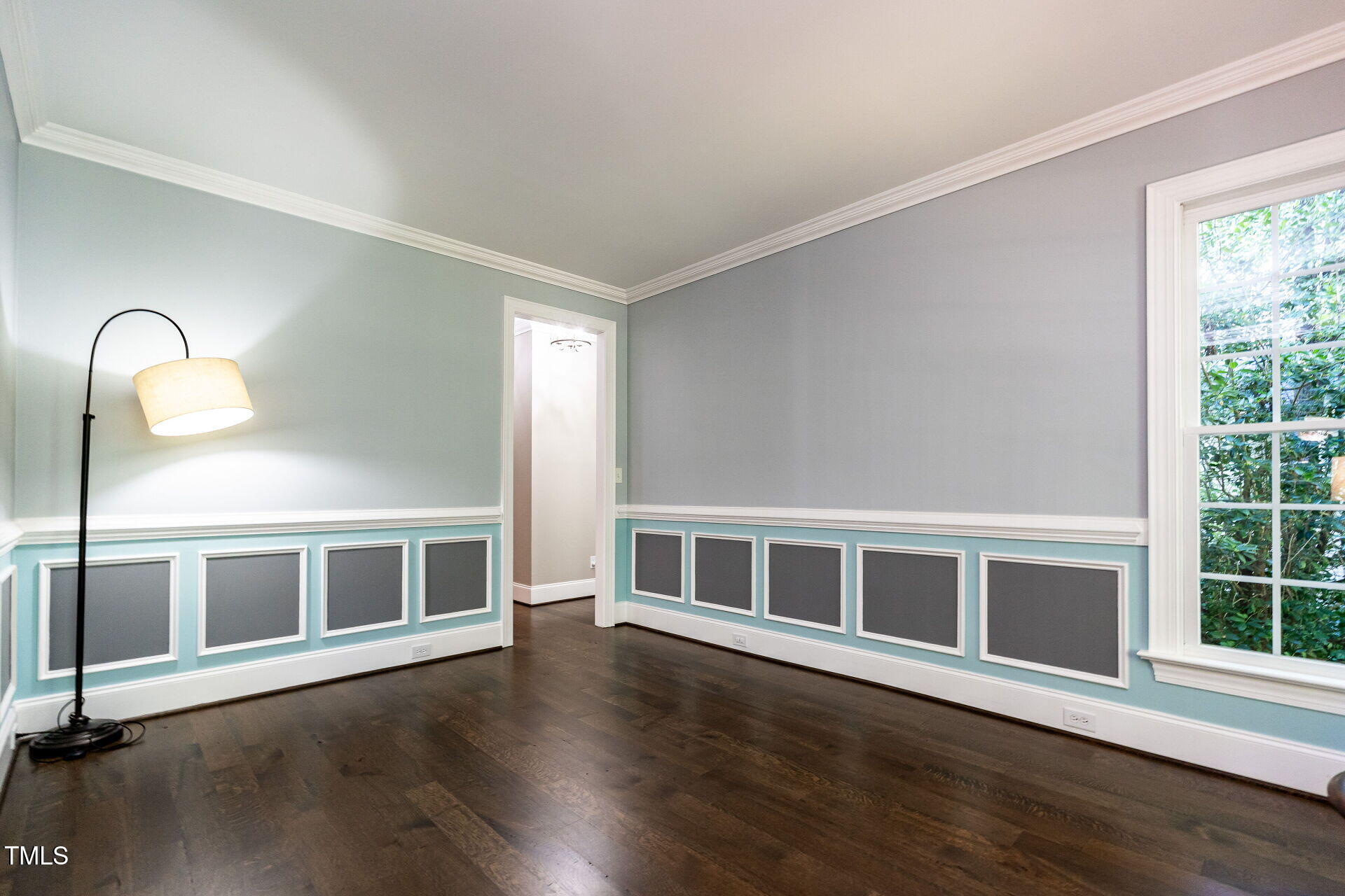 1228 Dorleath Court Raleigh, NC 27614 - Photo 20 of 47 a view of an empty room with wooden floor and a window