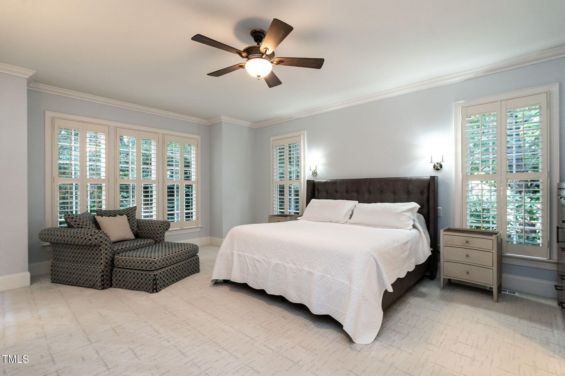 1228 Dorleath Court Raleigh, NC 27614 - Photo 22 of 47 a spacious bedroom with a bed a couch and a large window