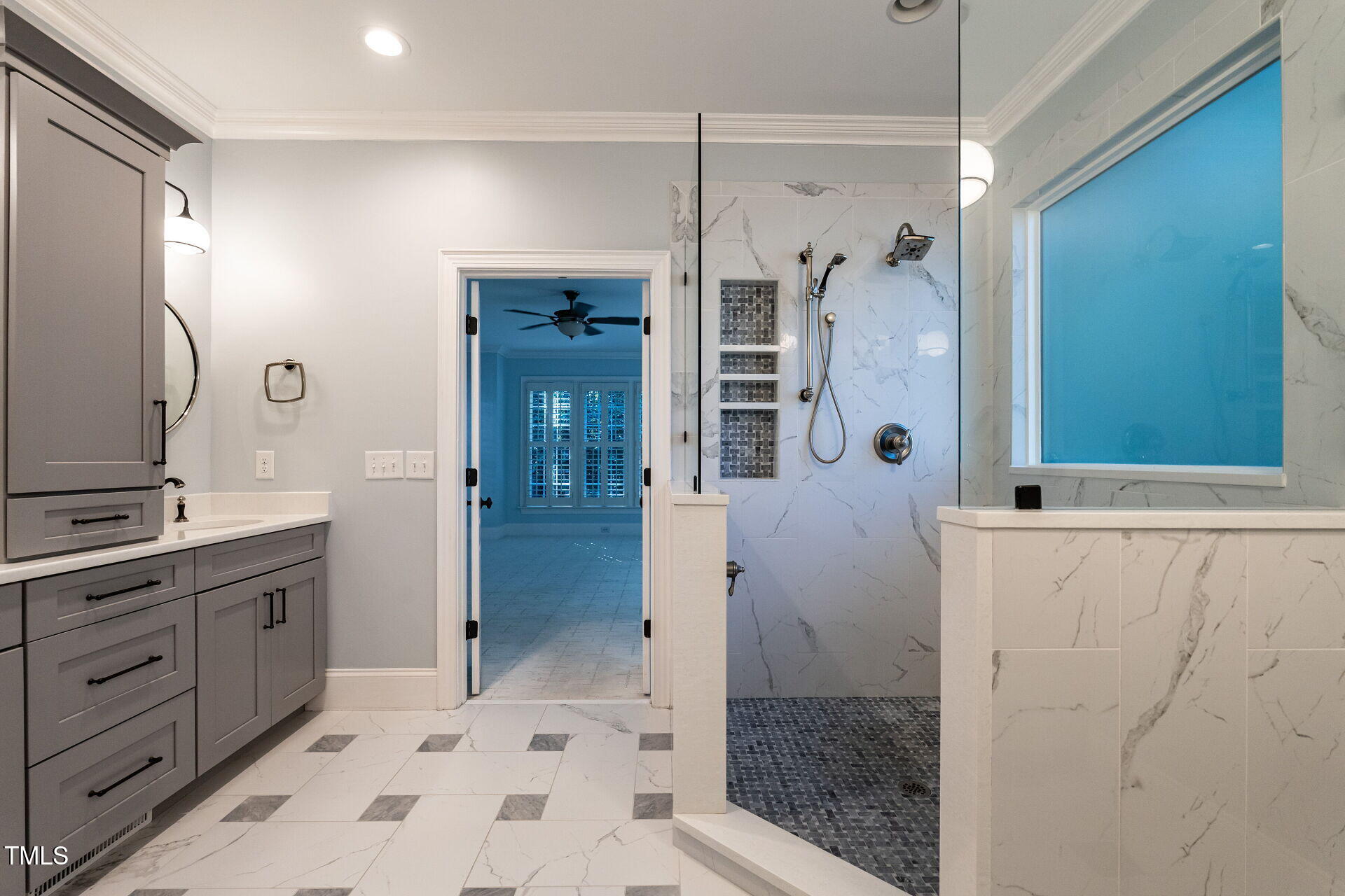 1228 Dorleath Court Raleigh, NC 27614 - Photo 24 of 47 a bathroom with a shower sink and mirror