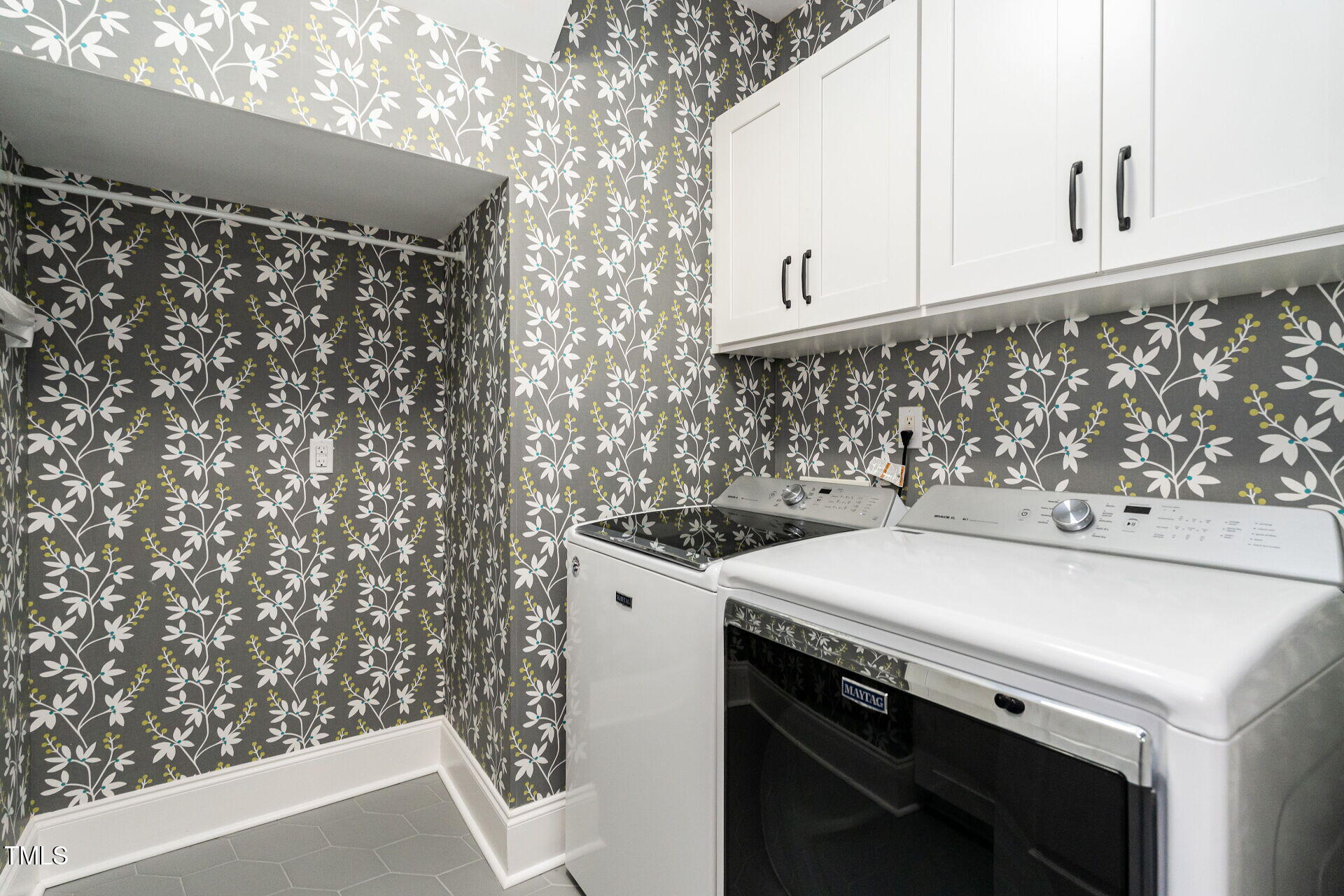 1228 Dorleath Court Raleigh, NC 27614 - Photo 28 of 47 a view of washer and dryer with kitchen view