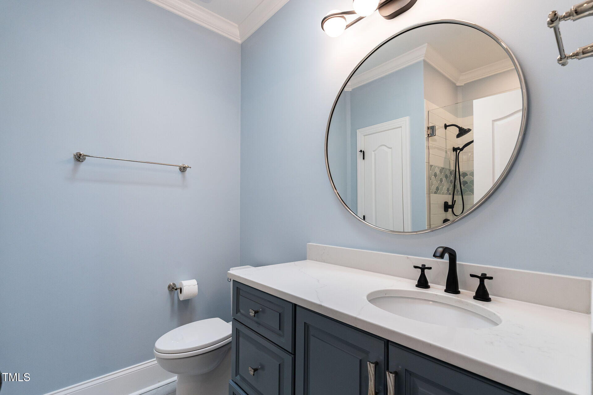 1228 Dorleath Court Raleigh, NC 27614 - Photo 31 of 47 a bathroom with a sink and a mirror