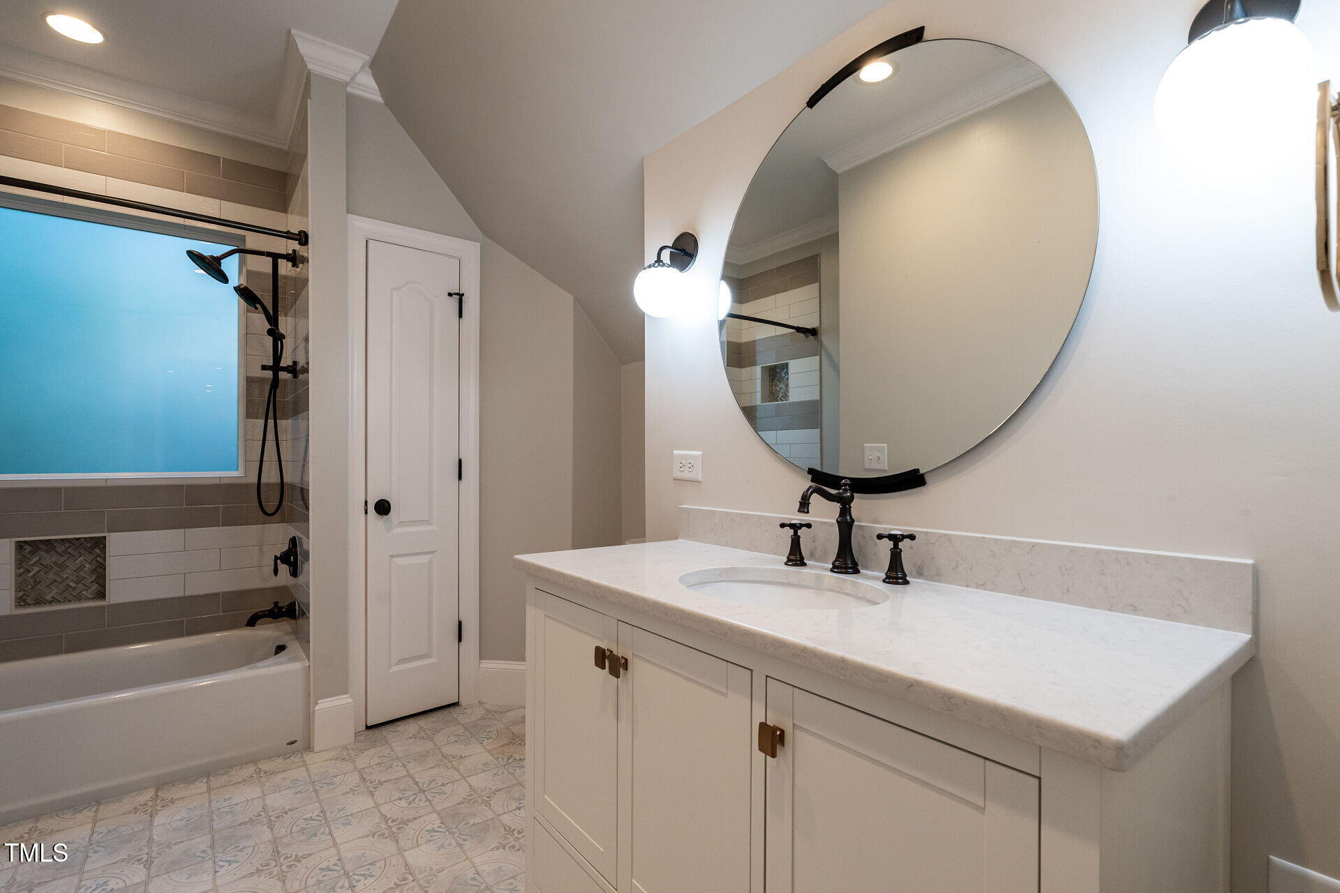 1228 Dorleath Court Raleigh, NC 27614 - Photo 33 of 47 a bathroom with a sink a mirror and a bathtub