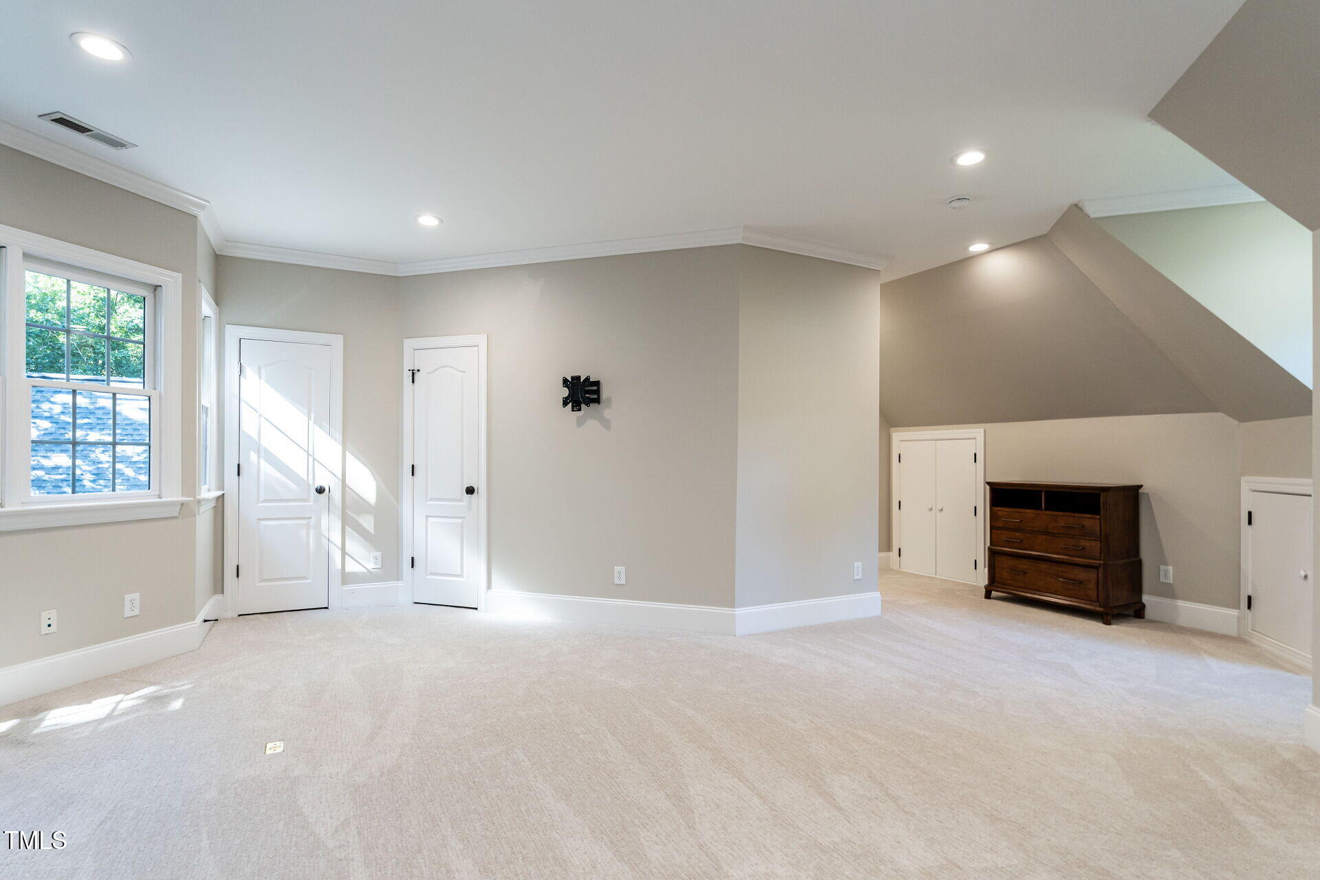 1228 Dorleath Court Raleigh, NC 27614 - Photo 36 of 47 an empty room with fireplace and window