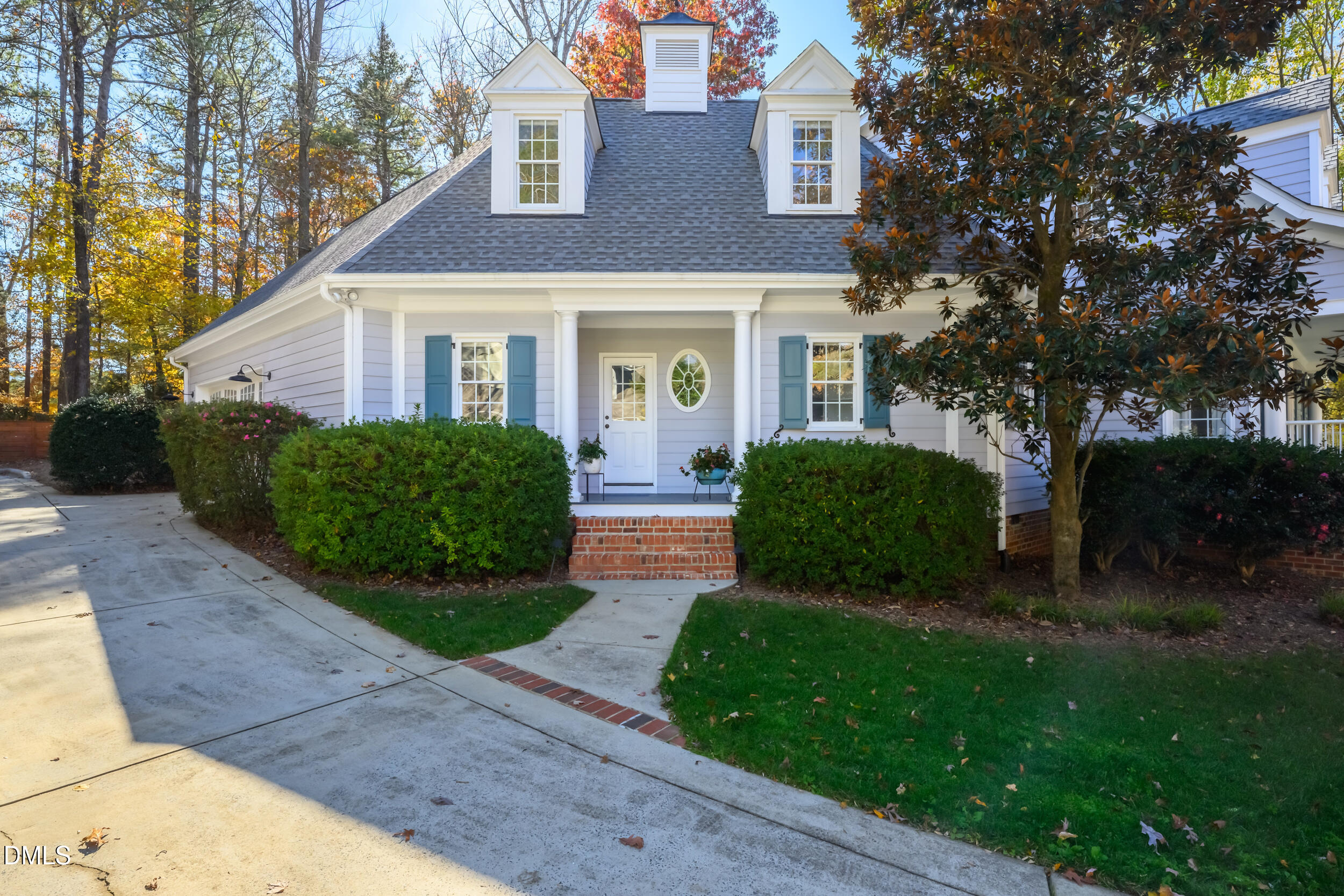 1228 Dorleath Court Raleigh, NC 27614 - Photo 46 of 47 a front view of a house with a yard and outdoor seating