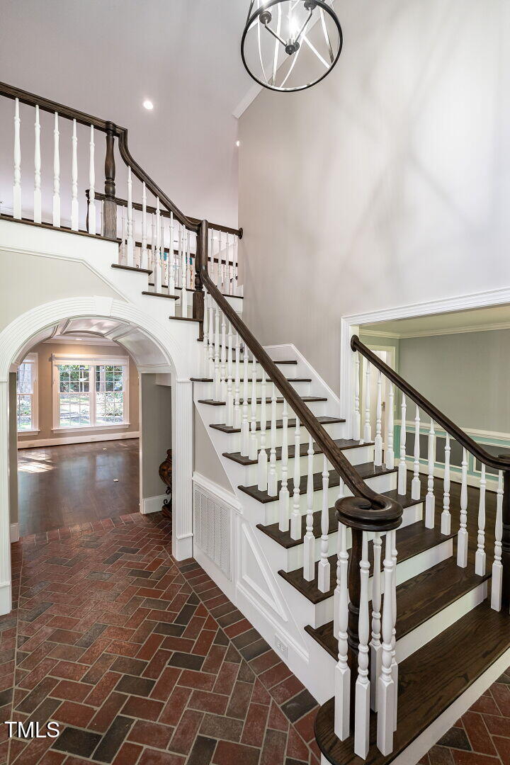 1228 Dorleath Court Raleigh, NC 27614 - Photo 5 of 47 a view of entryway with wooden floor and stairs