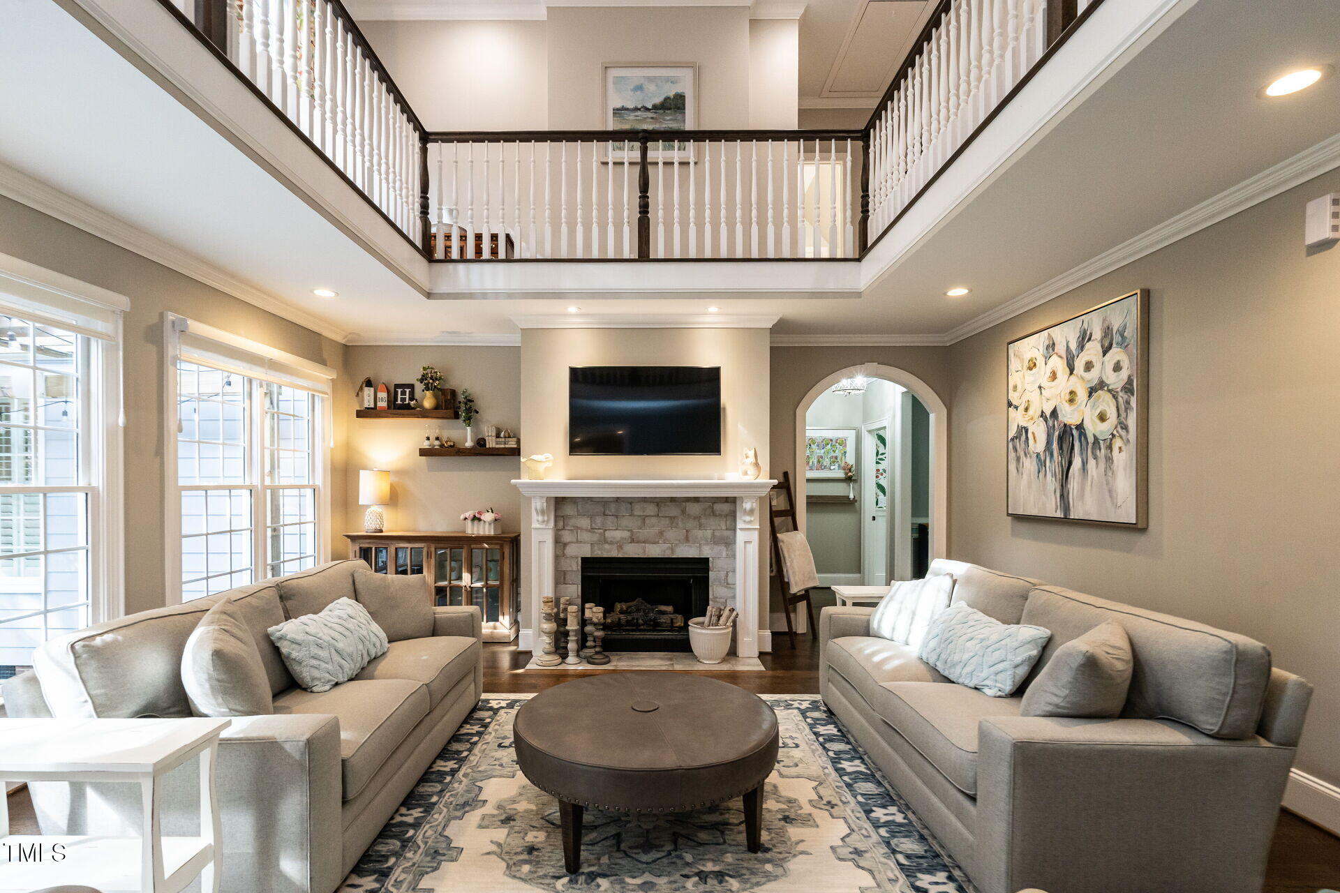 1228 Dorleath Court Raleigh, NC 27614 - Photo 7 of 47 a living room with furniture fireplace and a large window