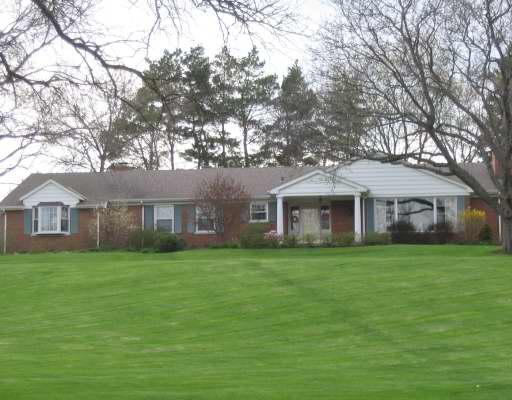 630 North Inverway Road Inverness, IL 60067 - Photo 1 of 1 a front view of a house with a garden