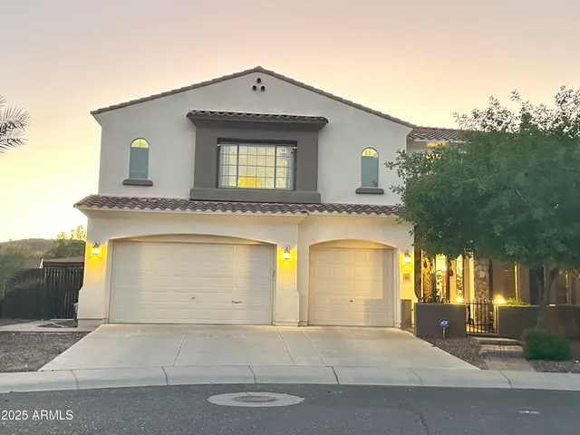 a front view of a house with a garage