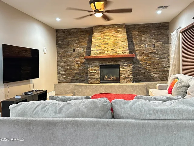 a living room with a couch and a flat screen tv