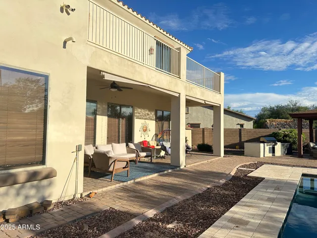 a view of a building with furniture