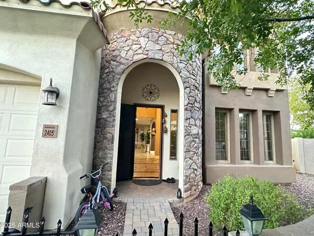 a front view of a house with many windows