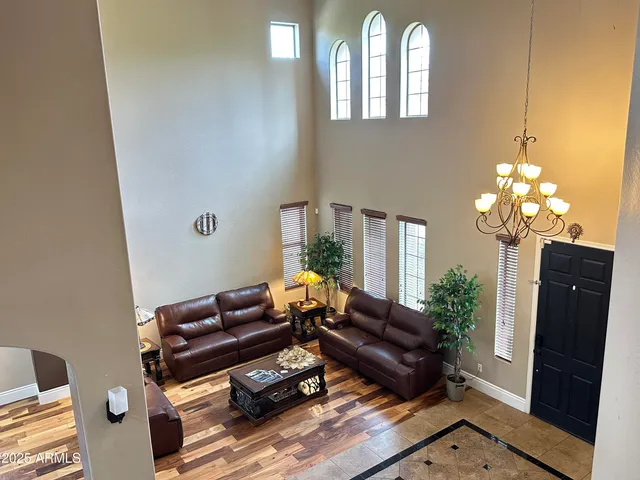 a living room with furniture rug and wooden floor