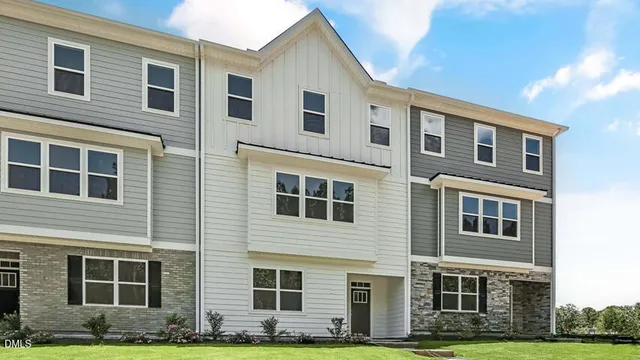 a front view of a house with yard