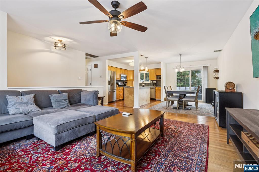 4 Birch Road Ringwood, NJ 07456 - Photo 11 of 41 a living room with furniture a rug and a chandelier