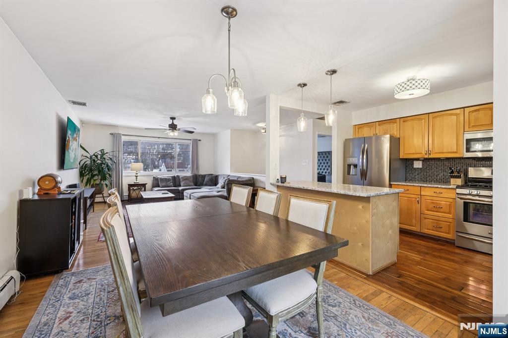 4 Birch Road Ringwood, NJ 07456 - Photo 12 of 41 a large kitchen with sink a refrigerator and chairs
