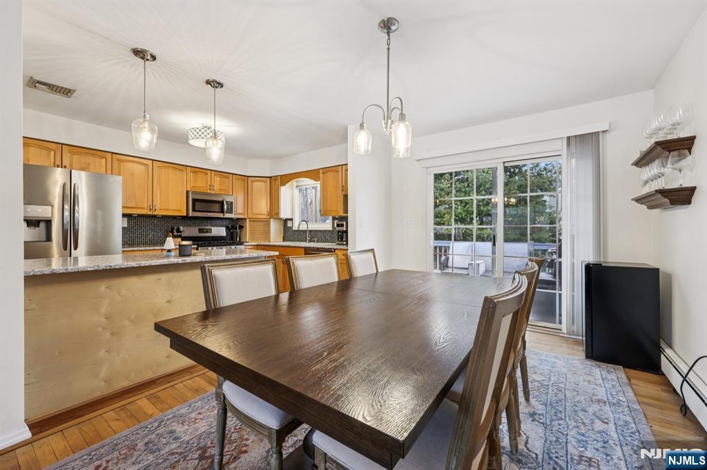 4 Birch Road Ringwood, NJ 07456 - Photo 13 of 41 a large kitchen with a table and chairs