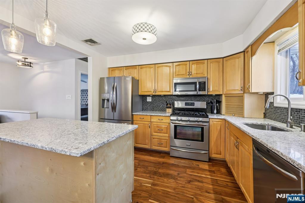 4 Birch Road Ringwood, NJ 07456 - Photo 18 of 41 a kitchen with stainless steel appliances granite countertop a sink stove and refrigerator