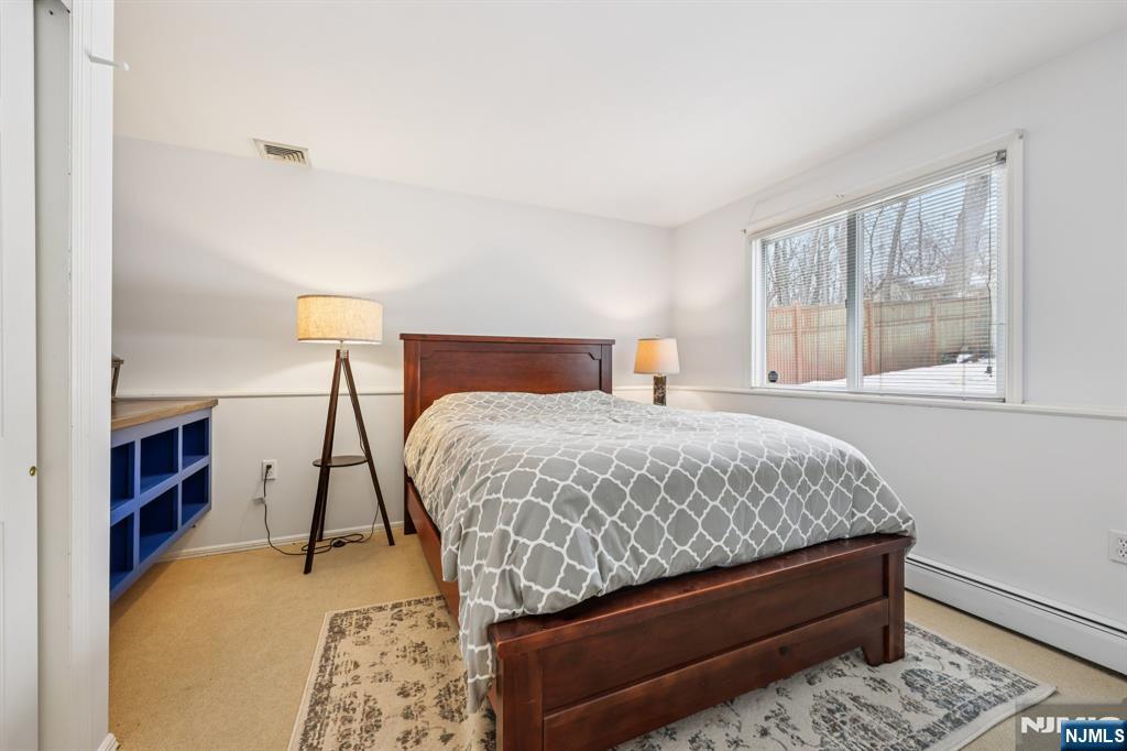 4 Birch Road Ringwood, NJ 07456 - Photo 22 of 41 a bedroom with a bed and a window