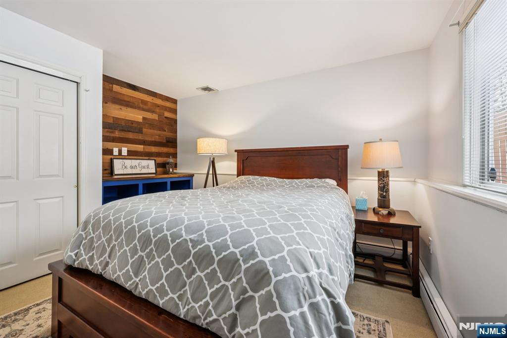 4 Birch Road Ringwood, NJ 07456 - Photo 23 of 41 a bedroom with a bed and a window