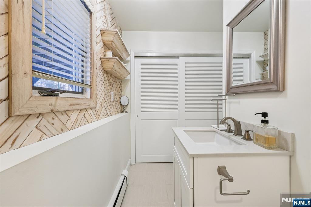4 Birch Road Ringwood, NJ 07456 - Photo 25 of 41 a bathroom with a sink and a mirror