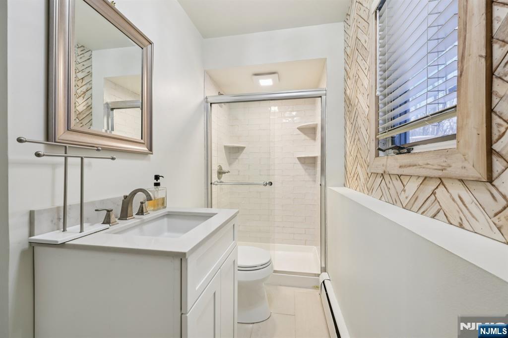 4 Birch Road Ringwood, NJ 07456 - Photo 26 of 41 a bathroom with a sink a toilet and shower