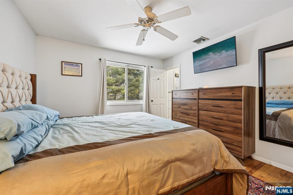 4 Birch Road Ringwood, NJ 07456 - Photo 28 of 41 a bedroom with a bed and a flat screen tv