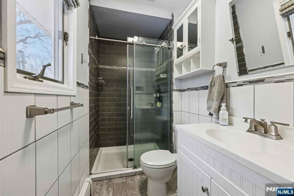 4 Birch Road Ringwood, NJ 07456 - Photo 30 of 41 a bathroom with a shower toilet and sink