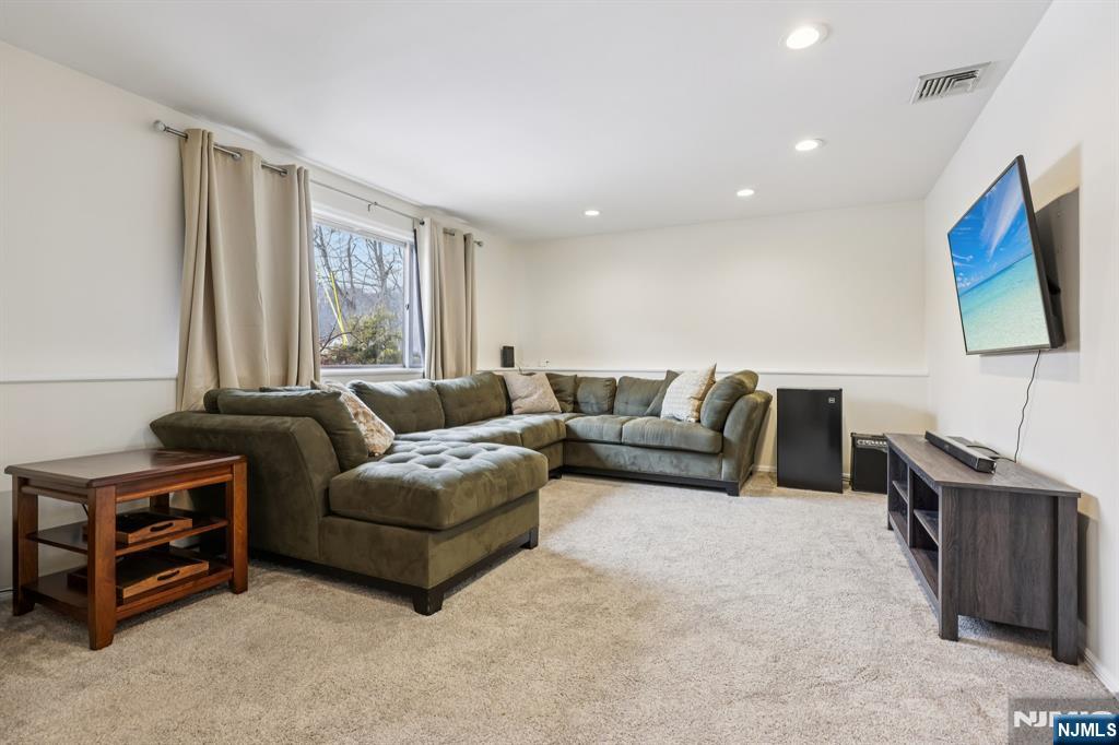 4 Birch Road Ringwood, NJ 07456 - Photo 7 of 41 a living room with furniture and a flat screen tv