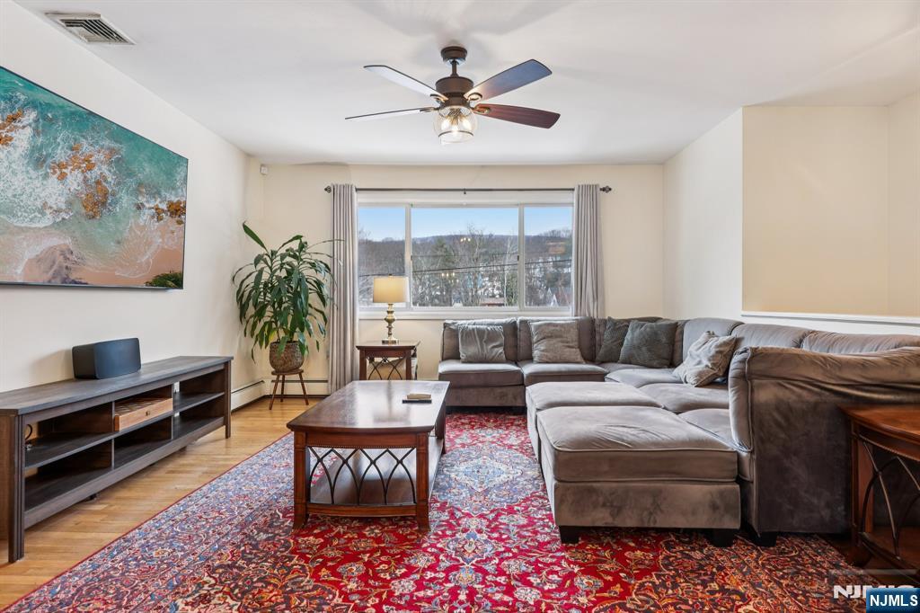 4 Birch Road Ringwood, NJ 07456 - Photo 10 of 41 a living room with furniture ceiling fan and a rug