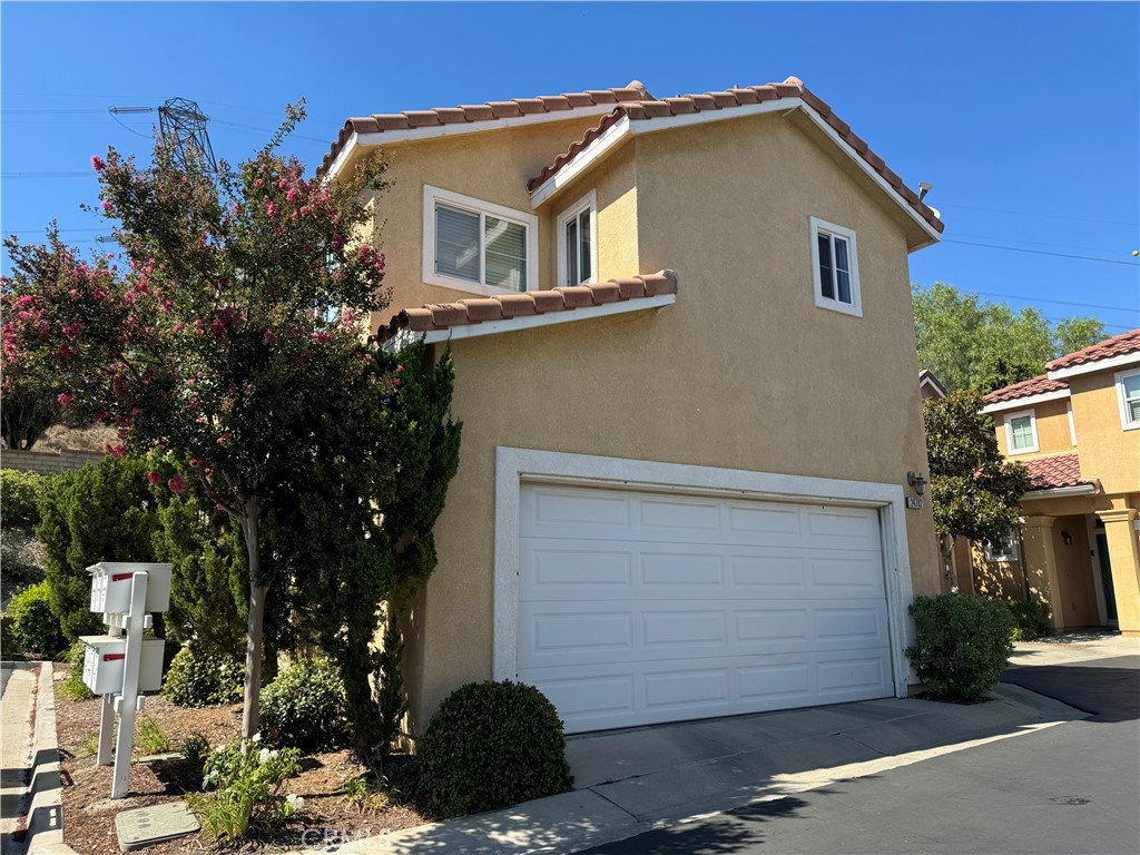 24702 Montevista Circle Valencia, CA 91354 - Photo 24 of 25 a front view of a house with a garage