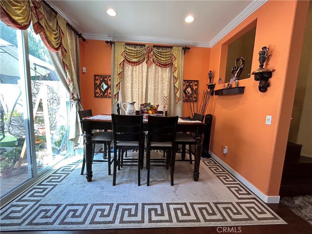 24702 Montevista Circle Valencia, CA 91354 - Photo 3 of 25 a view of a dining room with furniture window and wooden floor