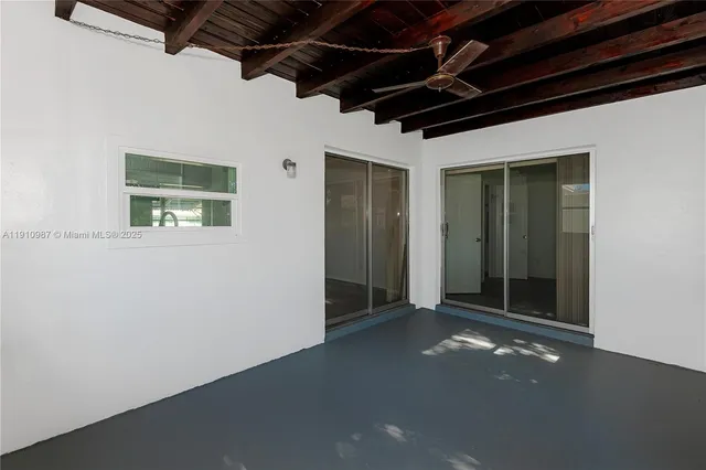 a view of a room with wooden walls
