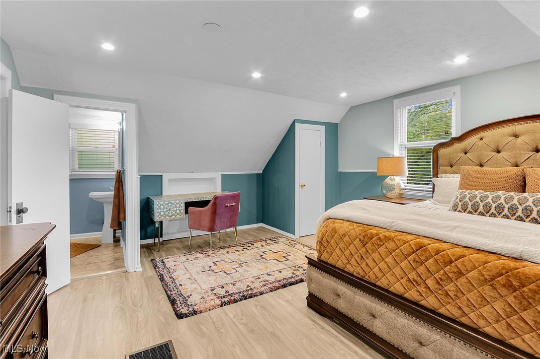 2289 Lamberton Road Cleveland, OH 44118 - Photo 24 of 31 The third-floor bedroom suite features LVT flooring, spacious enough for a large bed, attached bathroom