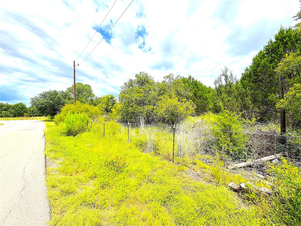 Tbd A Consolation Drive Millsap, TX 76066 - Photo 15 of 16 a swimming pool with an outdoor space and seating area