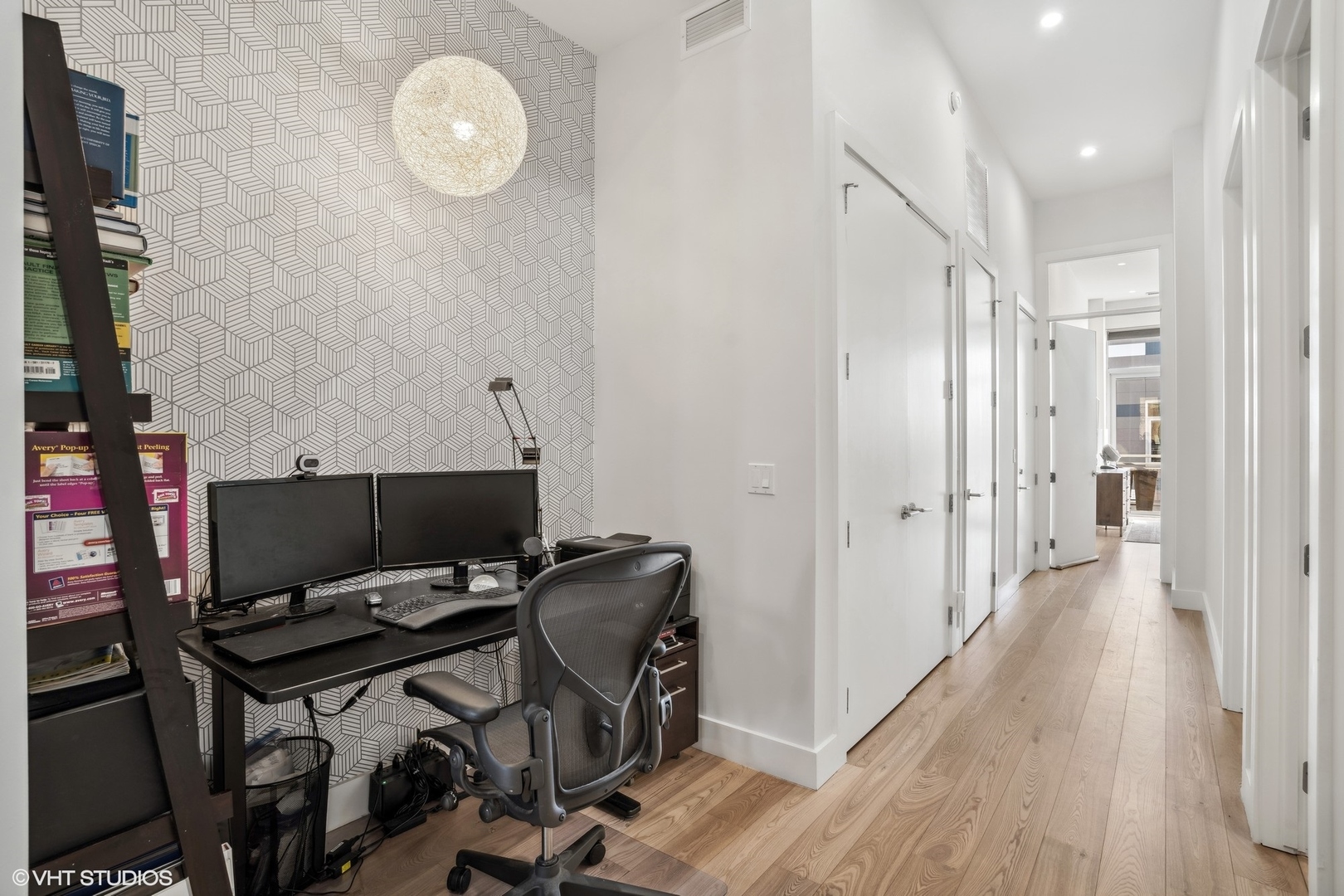 128 South Aberdeen Street, Unit PHN Chicago, IL 60607 - Photo 16 of 43 a view of a workspace with furniture and wooden floor