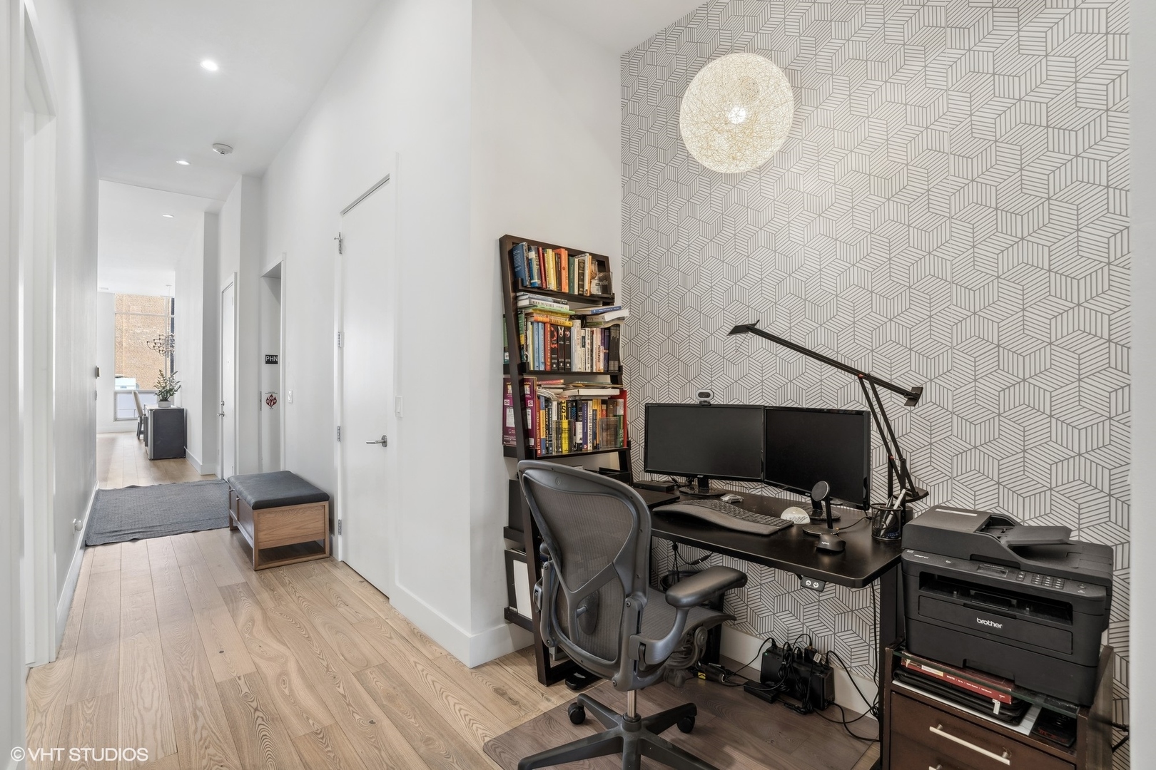 128 South Aberdeen Street, Unit PHN Chicago, IL 60607 - Photo 17 of 43 a view of a workspace with furniture and wooden floor