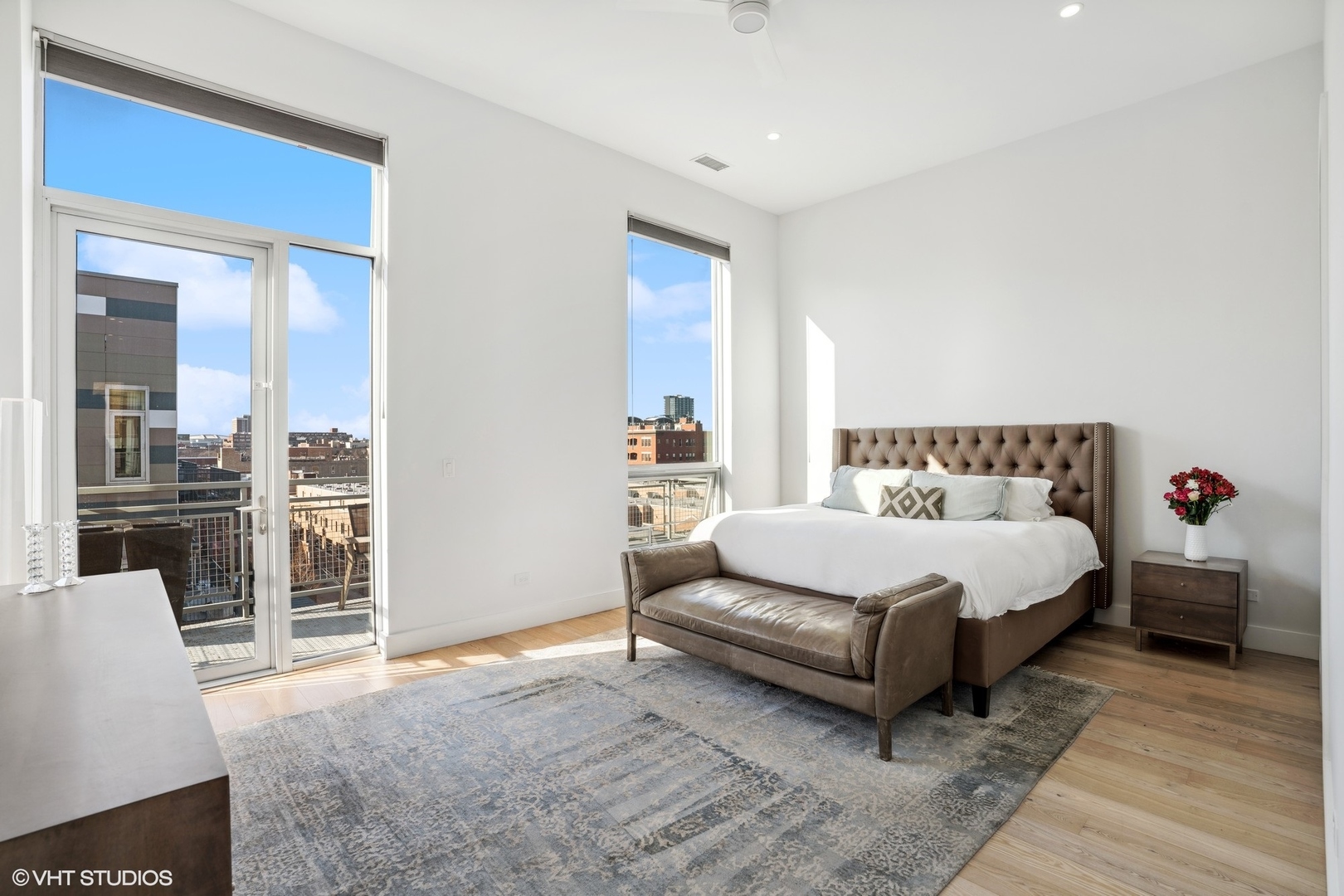 128 South Aberdeen Street, Unit PHN Chicago, IL 60607 - Photo 18 of 43 a spacious bedroom with a bed and a couch