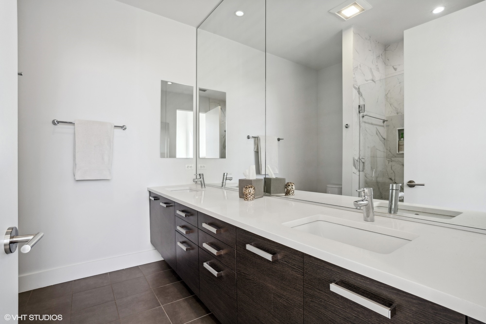 128 South Aberdeen Street, Unit PHN Chicago, IL 60607 - Photo 20 of 43 a bathroom with a double vanity sink and a mirror